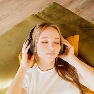 calm-young-woman-enjoys-listening-chill-music-audio-sound-meditating-feeling-no-stress-at-home_t20_Xvagz6